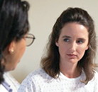 Female doctor talking to female patient